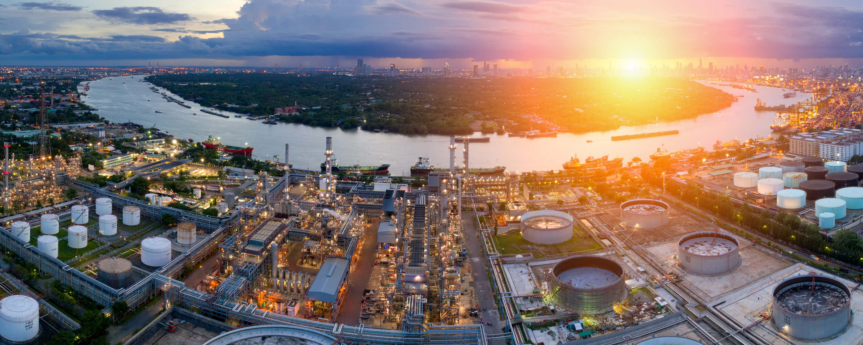 Aerial view of twilight of oil refinery ,Shot from drone of Oil refinery and Petrochemical plant at dusk , Bangkok, Thailand