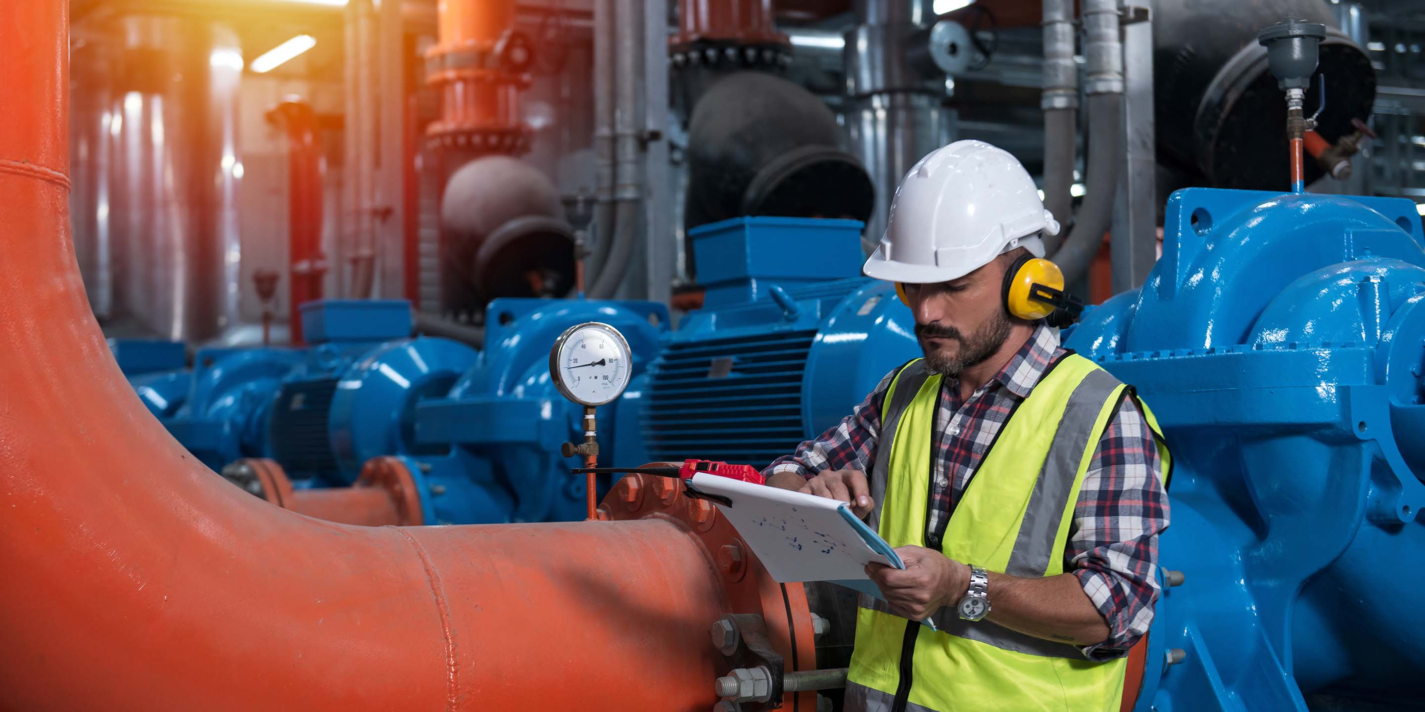 Mechanical engineer Checking of centrifugal pump in pump room. worker working in plant room.