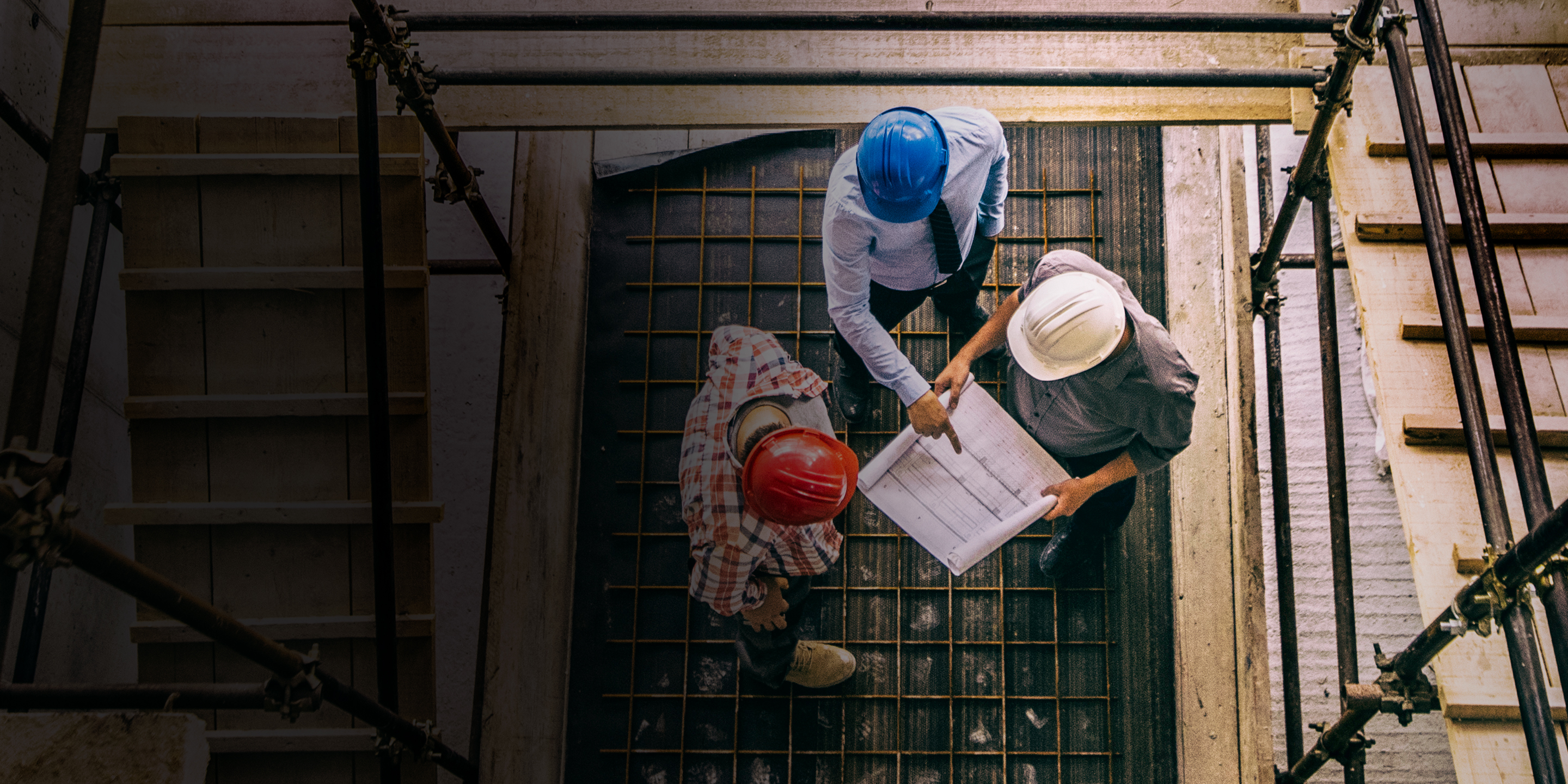 Construction crew reviewing blueprints