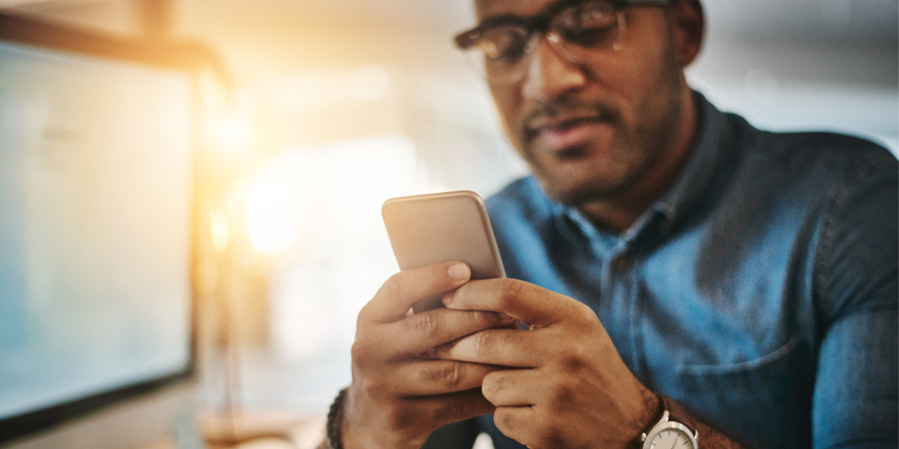 Man using handheld device