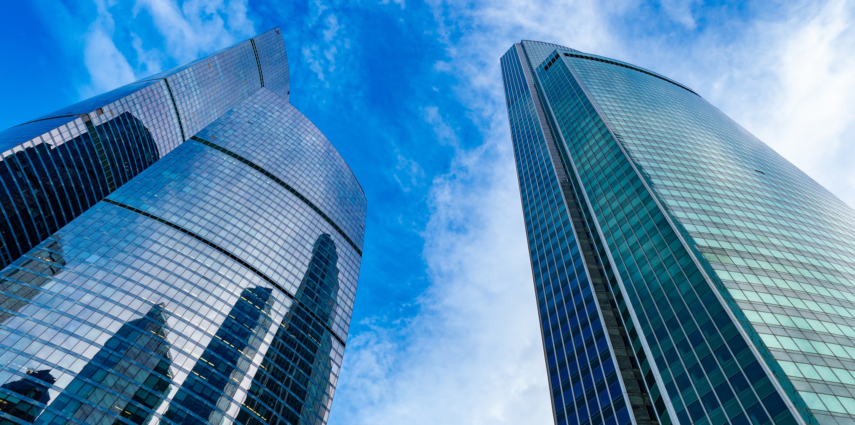Moskva-city. Bottom view of the skyscrapers in the center of the Russian capital. Business center of Moscow. Office rental. Office real estate. High-rise buildings against the blue sky.; Shutterstock ID 1714622212; Function downloaded by: William Brahler; Project use: Stock Library; Brand if appropriate: ; Notes: 
