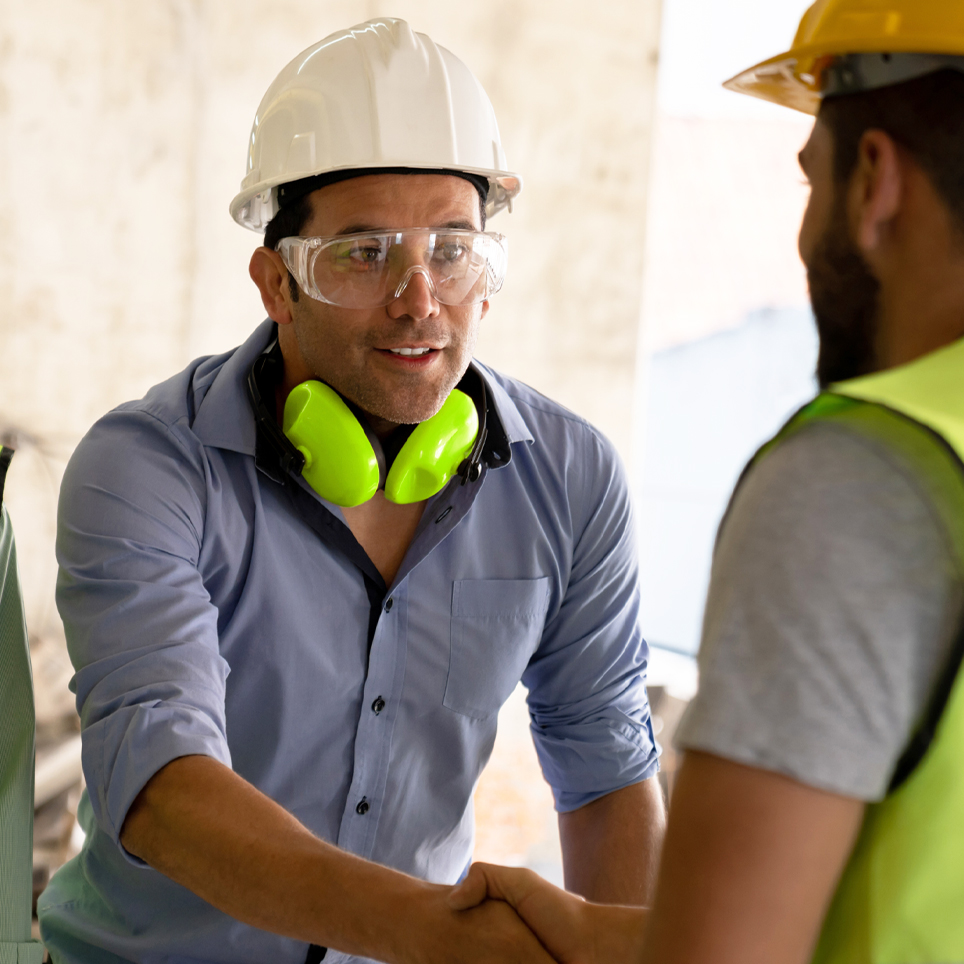 Guys in hardhats shaking hands