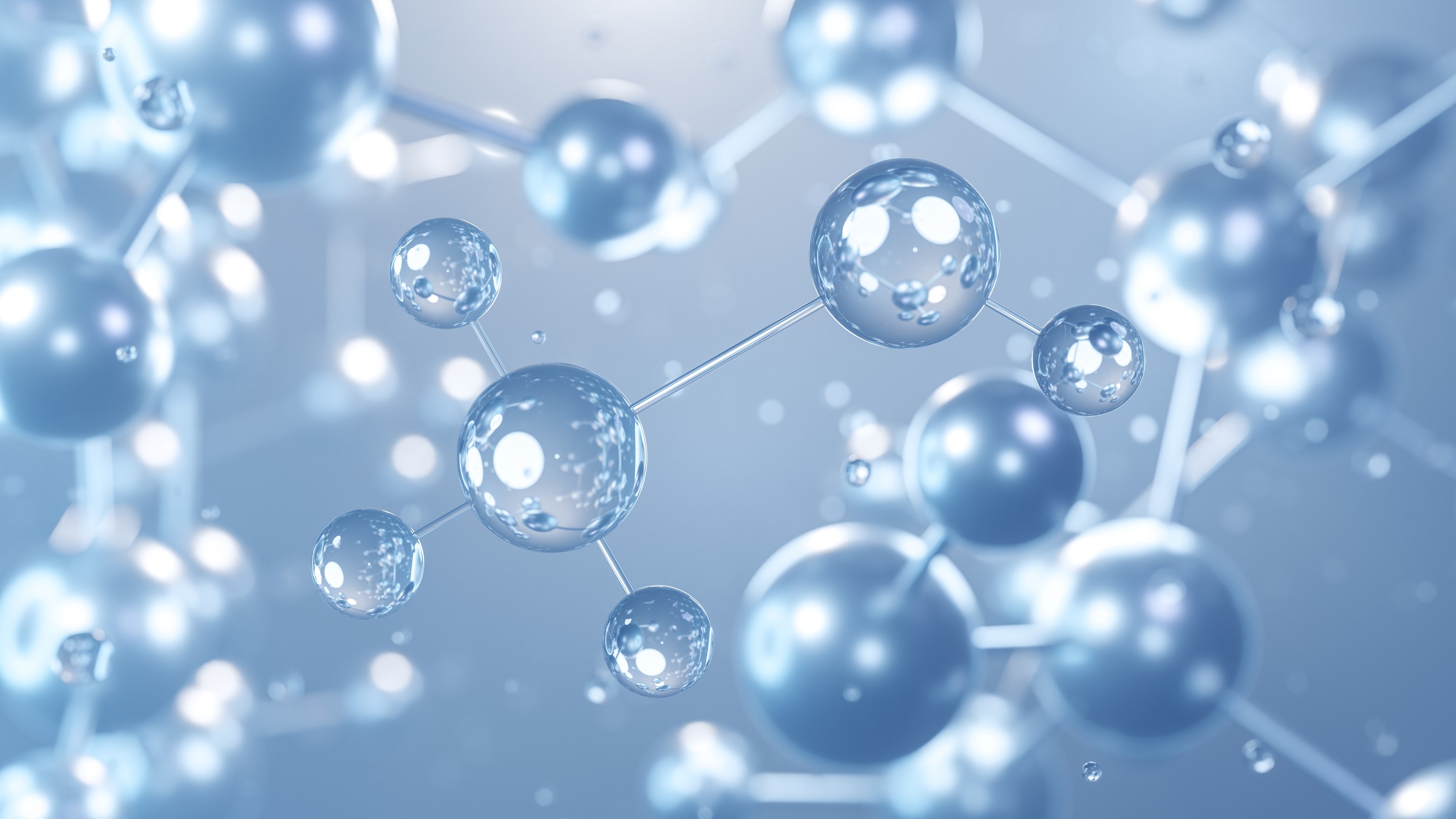 A close-up view of spheres and connections representing molecular structures in a blue-themed abstract design.