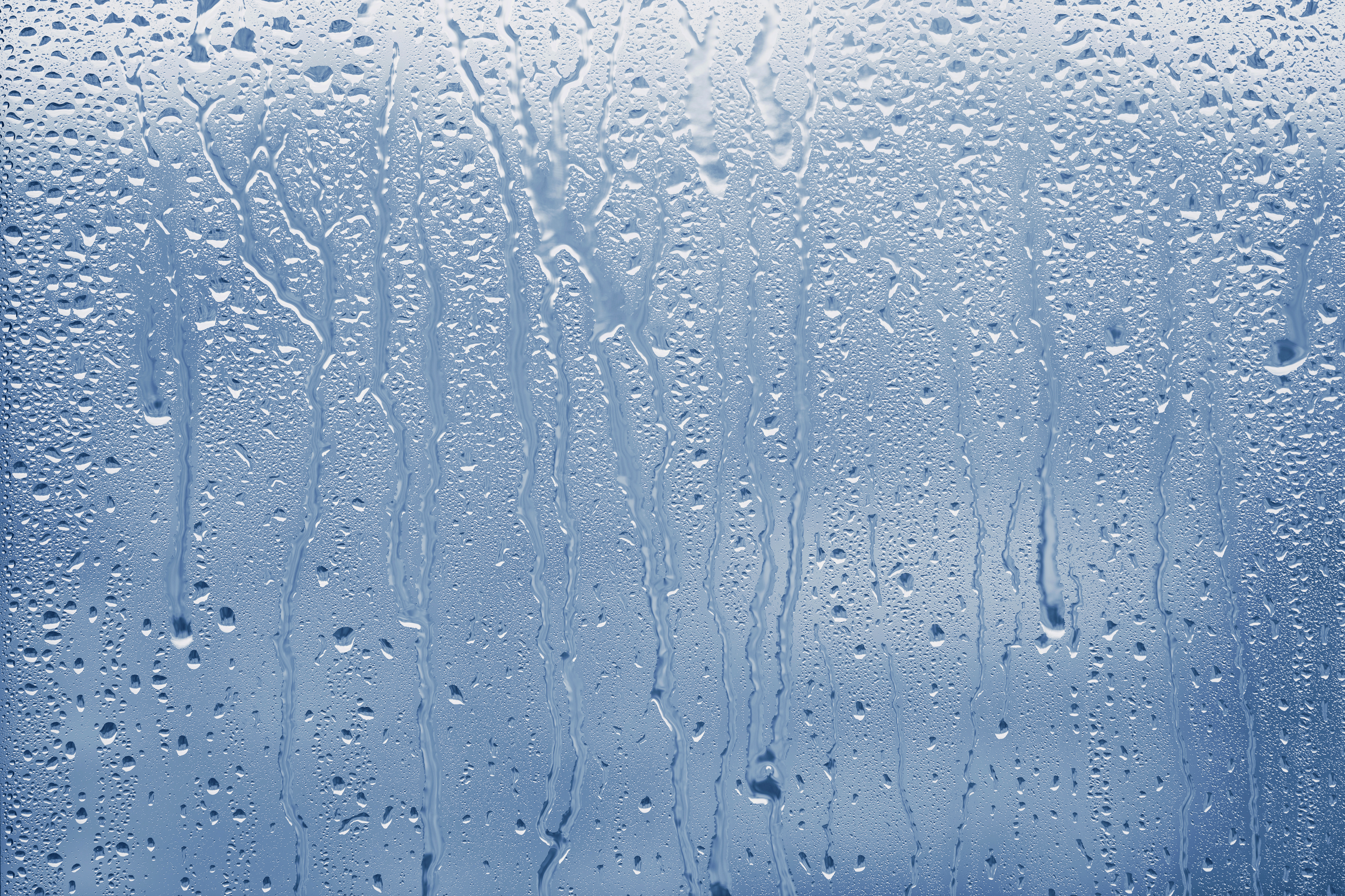 Condensation on glass window with water drops