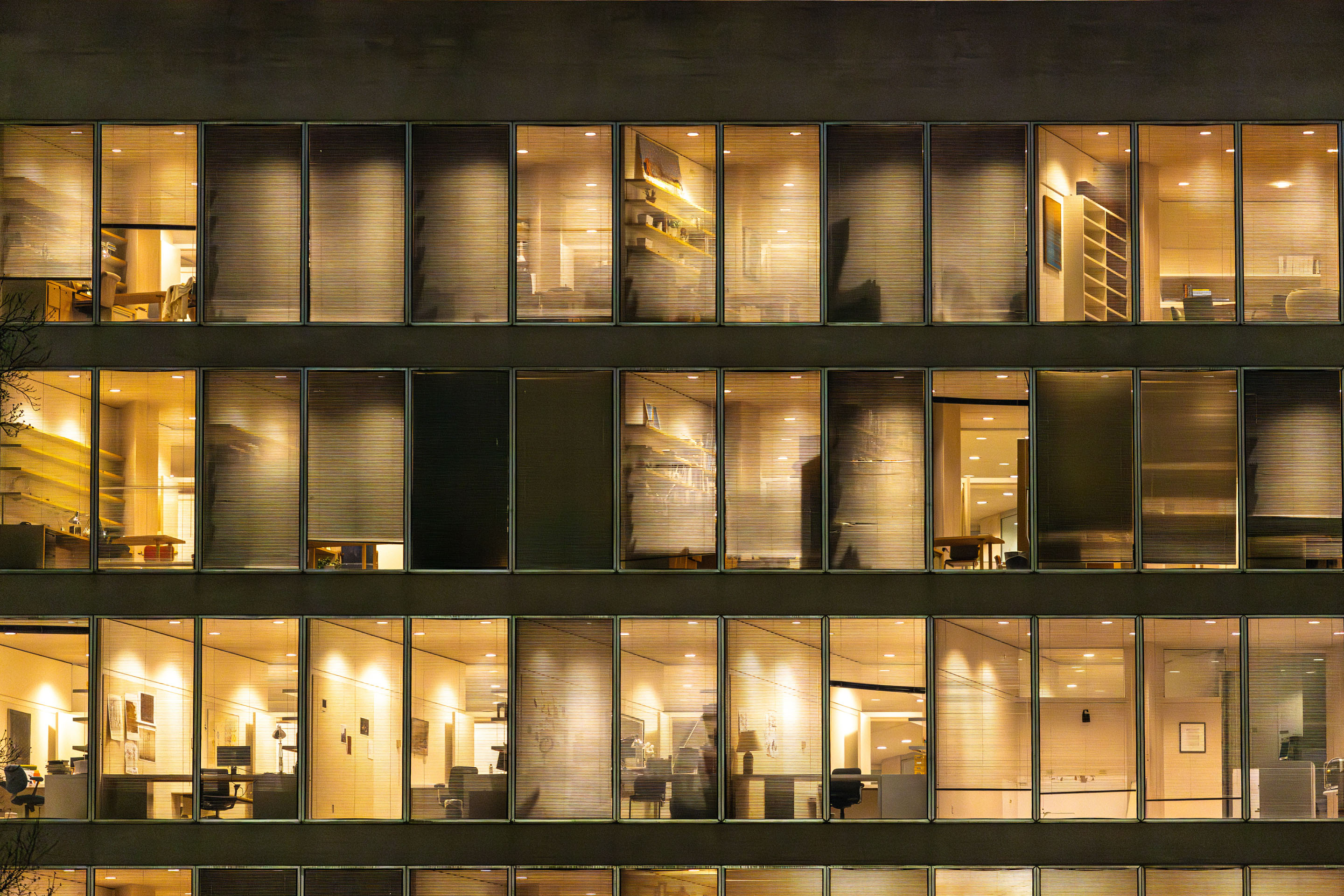 hon-office-building-illuminated-windows-night-2207367150.jpg