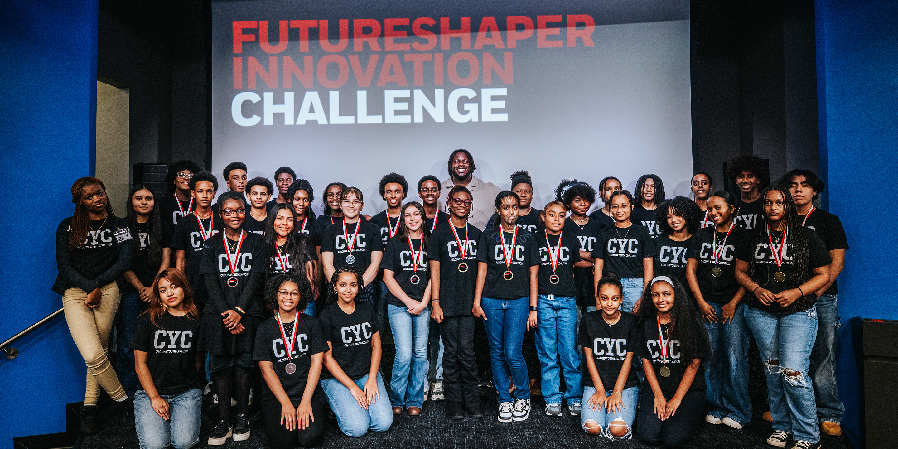 A group of students who participated in the 2024 Futureshaper Innovation Challenge pose in a group photo.