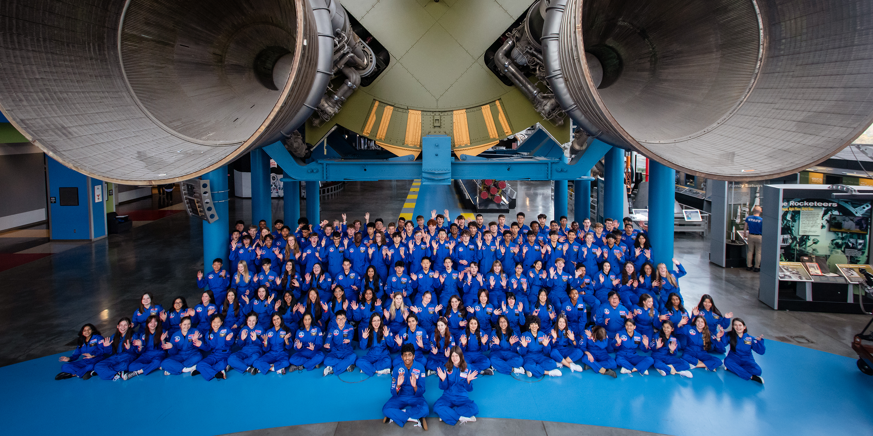 2024 Honeywell Leadership Challenge Academy participants wearing blue space suit uniforms at the U.S. Space and Rocket Center.
