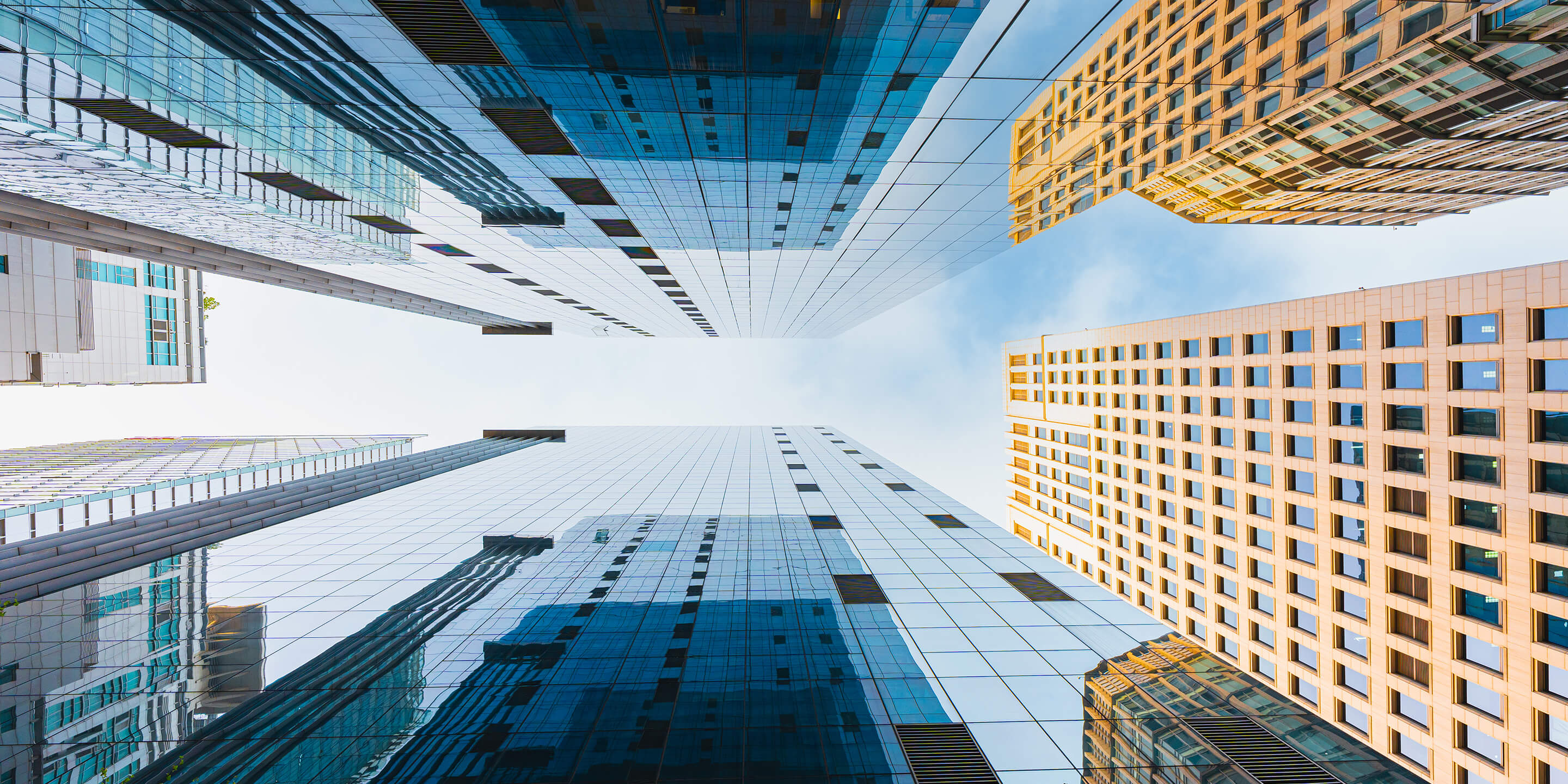 Glass Modern Building against Sky 