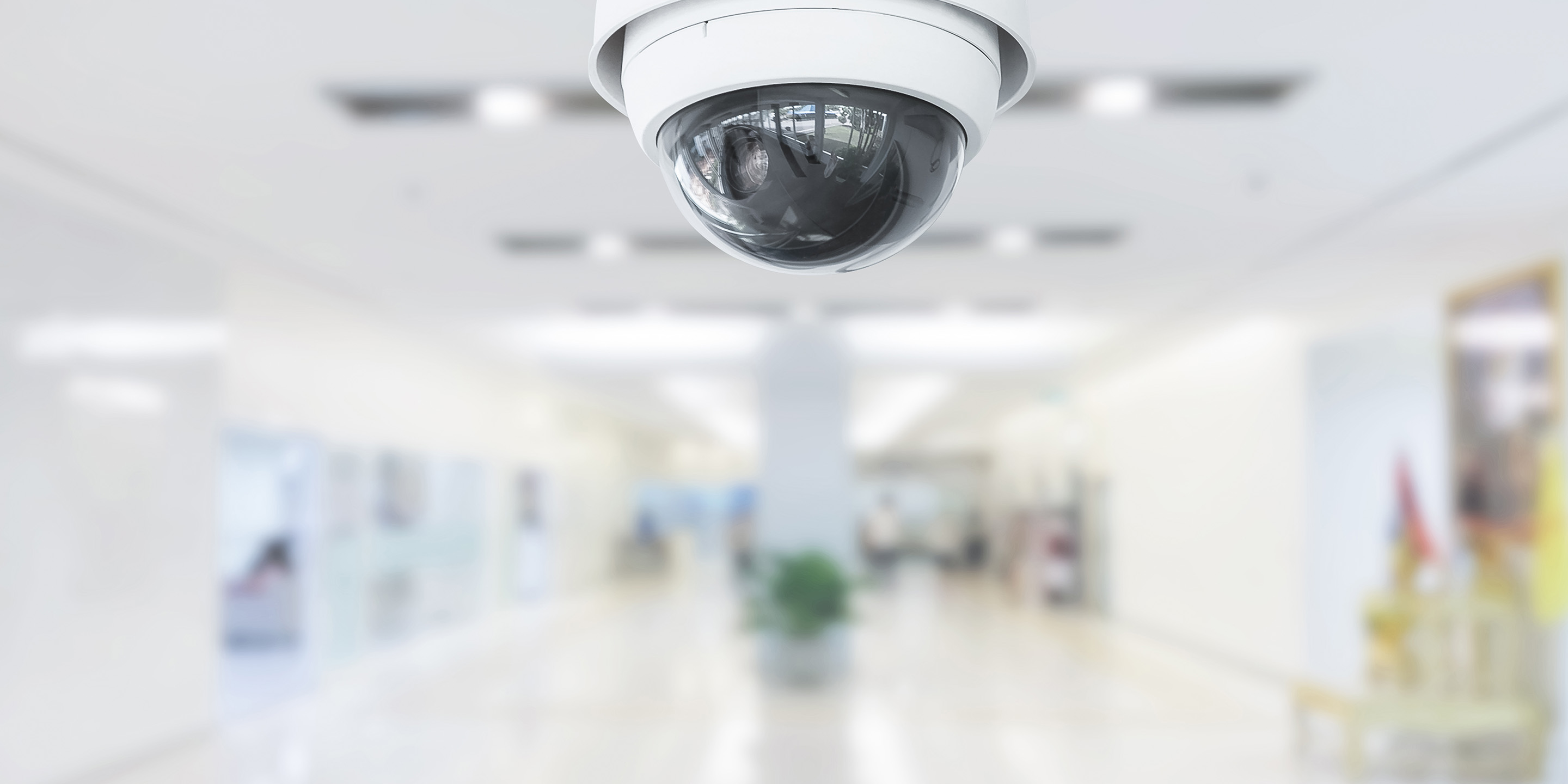 CCTV Camera monitoring office building hallway