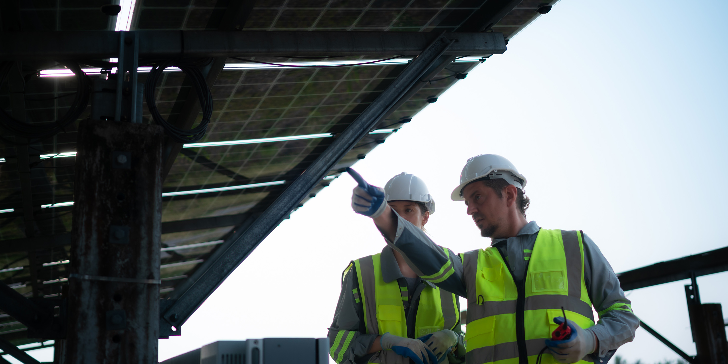Industrial Workers Monitoring Solar Panels
