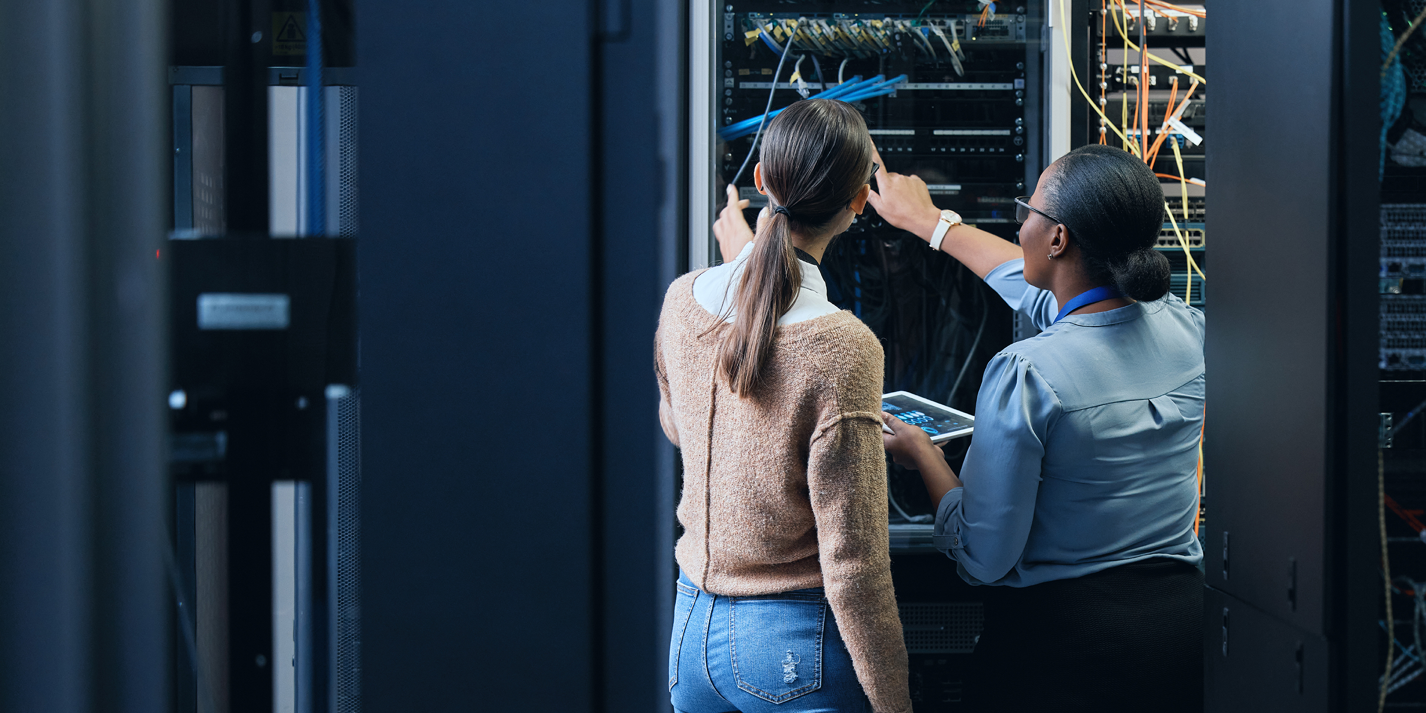 Two people in data center