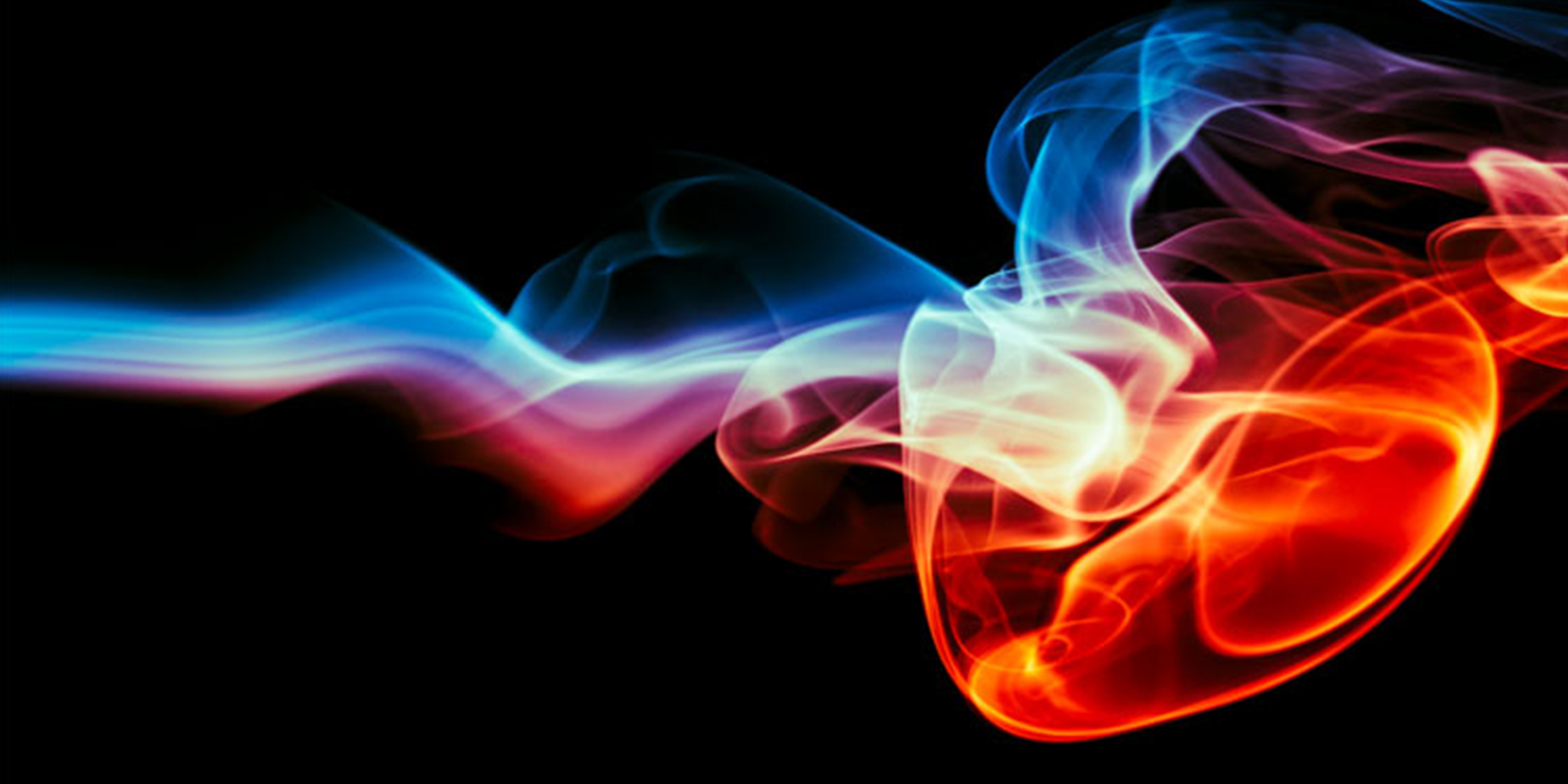 Dynamic blue and red smoke patterns swirling against a black backdrop. Perfect for evoking themes of energy, flames or differences between smoke detectors and flame detectors